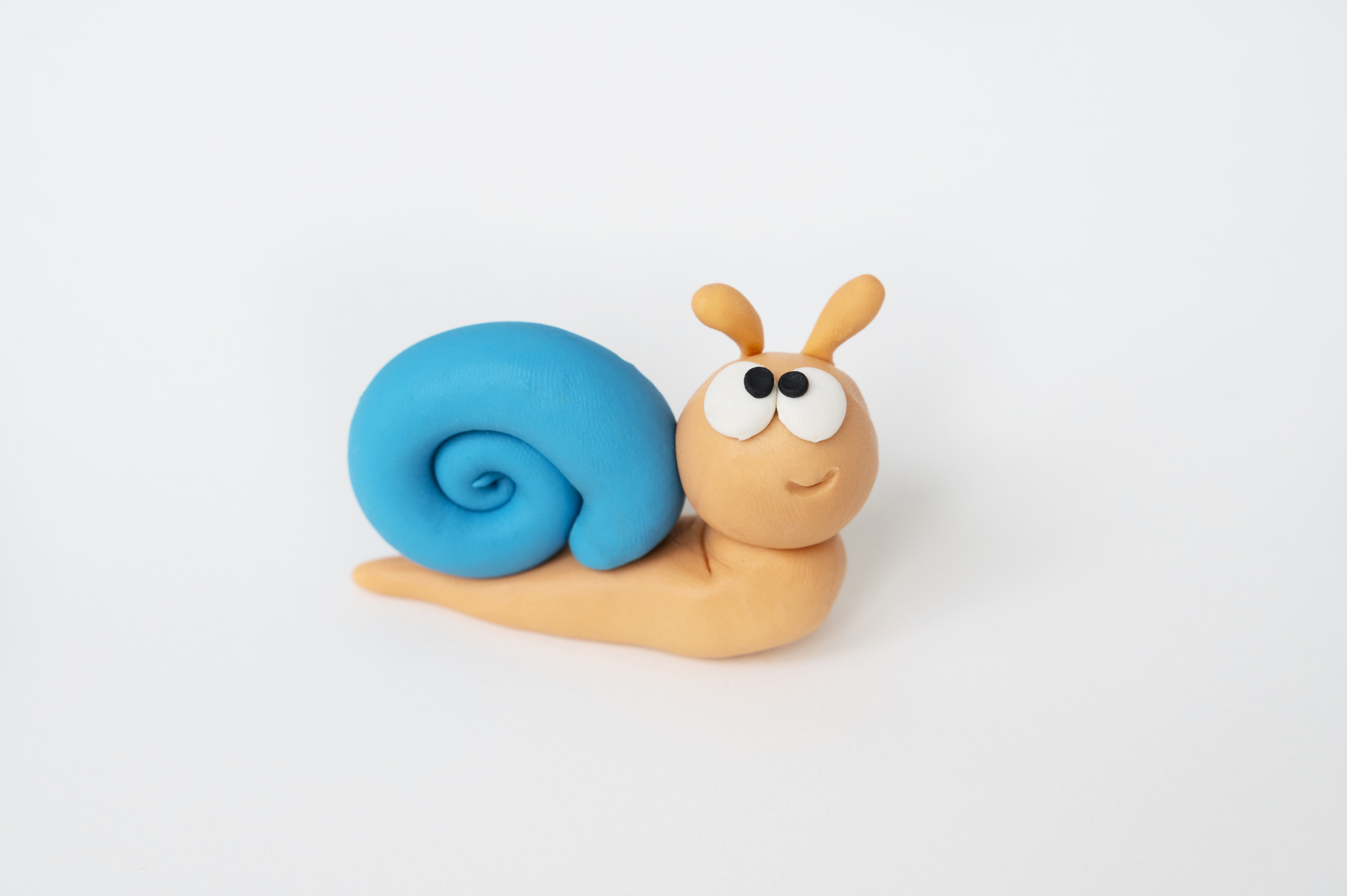 play-dough-background-with-snail-high-angle